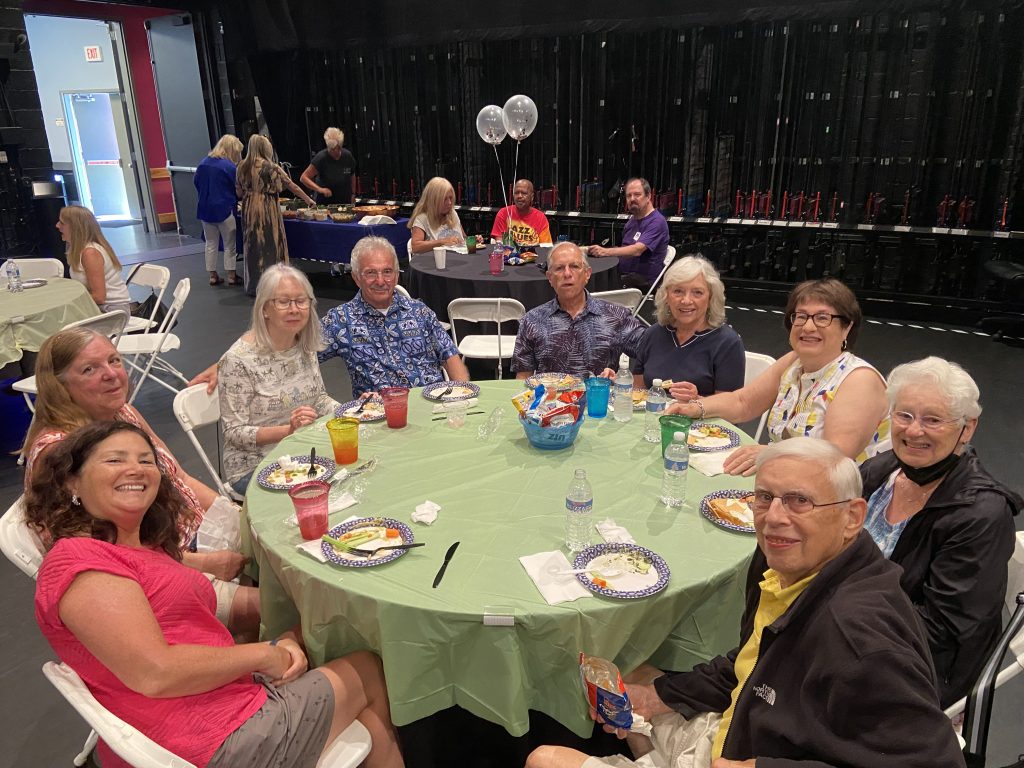 volunteers eating together at volunteer picnic
