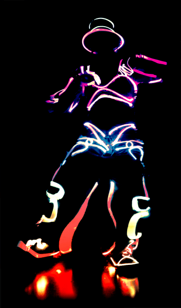 dancer in the dark with lit up costume