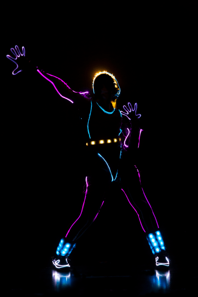 dancer in the dark with lit up costume