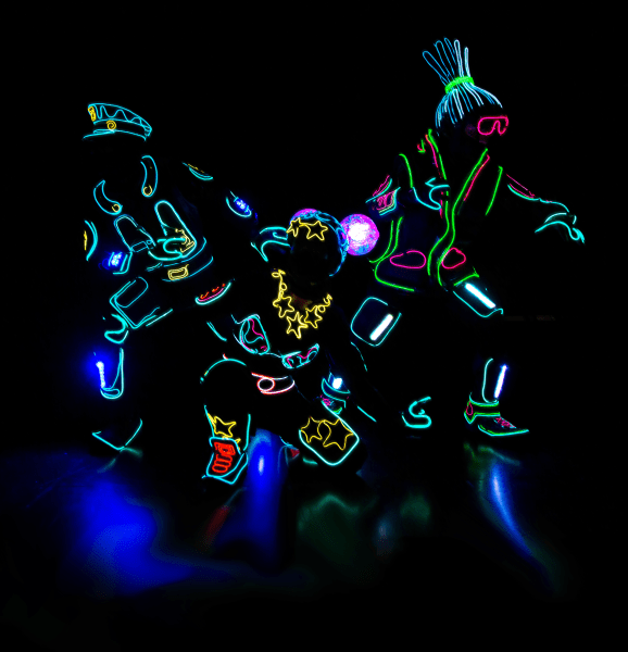 dancers in the dark with lit up costume