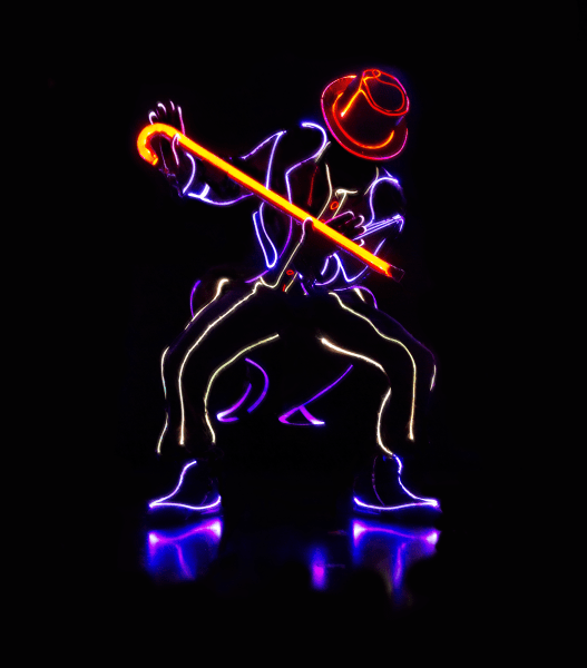 dancer in the dark with lit up costume